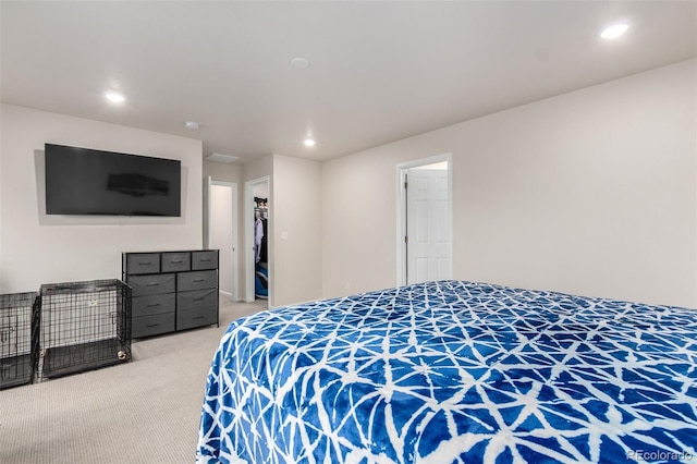 bedroom with carpet and a closet