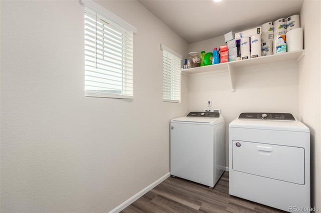 laundry area with dark hardwood / wood-style flooring and independent washer and dryer