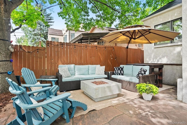 view of patio / terrace featuring an outdoor living space with a fire pit