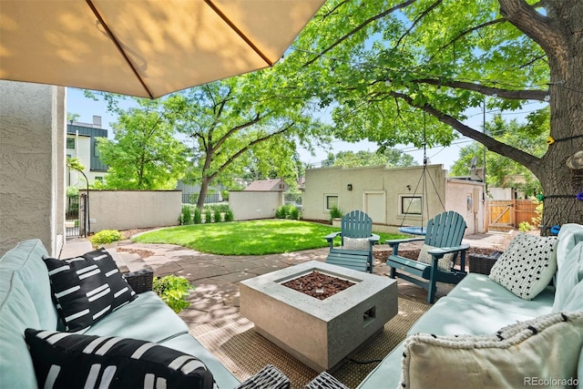 view of patio featuring an outdoor living space with a fire pit