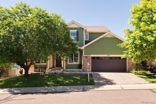 2214 E 101st Ave, Thornton, CO 80229 - view of front of property with brick siding, a garage, and driveway