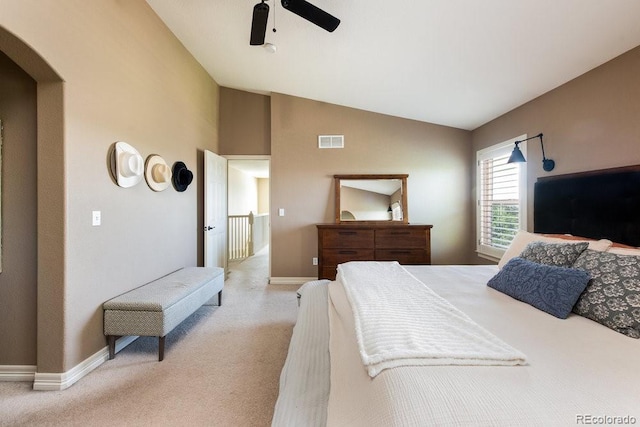 2214 E 101st Ave, Thornton, CO 80229 - bedroom featuring light carpet, lofted ceiling, a ceiling fan, and arched walkways