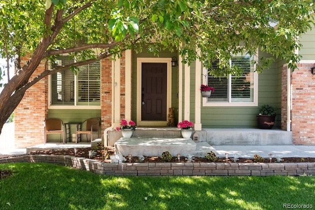 2214 E 101st Ave, Thornton, CO 80229 - property entrance featuring brick siding and covered porch