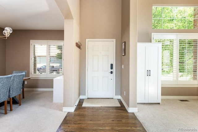 2214 E 101st Ave, Thornton, CO 80229 - entryway with wood finished floors and carpet floors