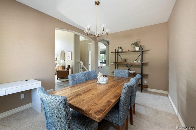 2214 E 101st Ave, Thornton, CO 80229 - carpeted dining space with arched walkways and a chandelier
