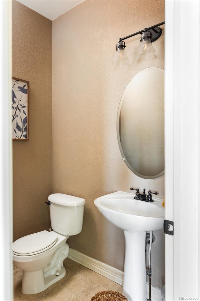 2214 E 101st Ave, Thornton, CO 80229 - half bathroom with toilet and tile patterned flooring