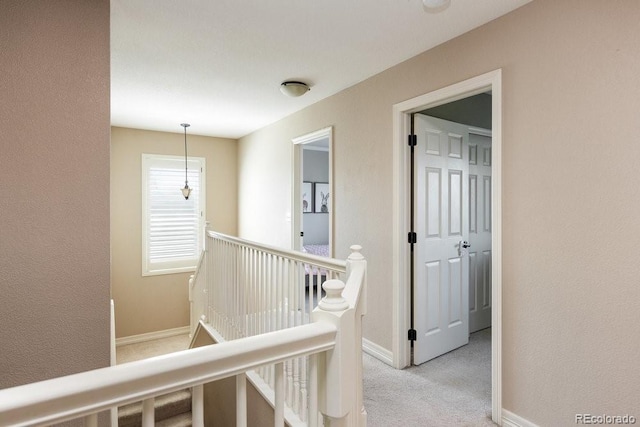 2214 E 101st Ave, Thornton, CO 80229 - corridor featuring an upstairs landing and light colored carpet