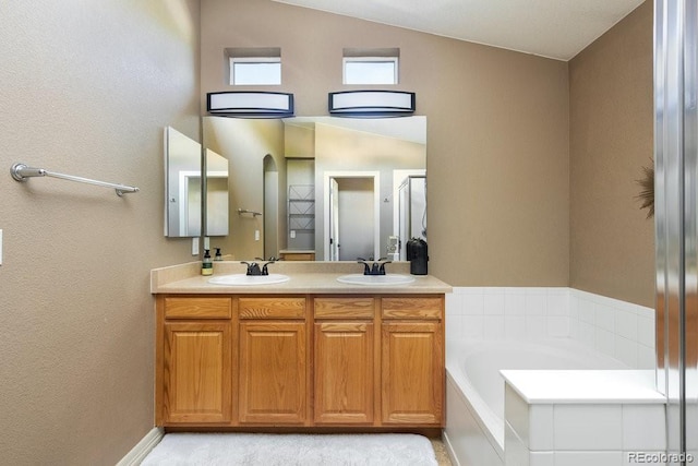 2214 E 101st Ave, Thornton, CO 80229 - full bath featuring a garden tub, double vanity, and lofted ceiling