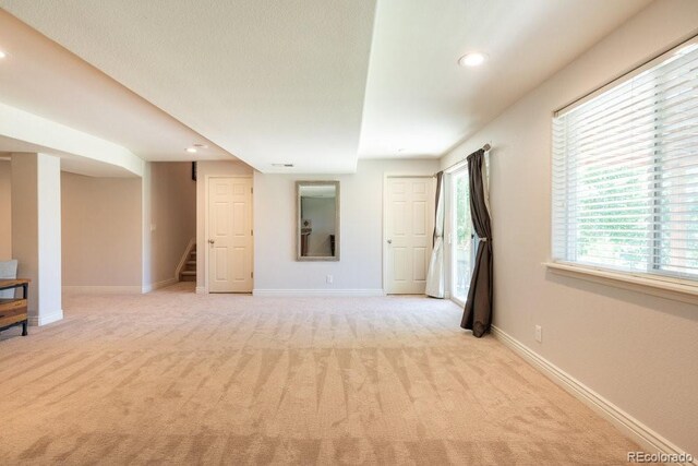 2214 E 101st Ave, Thornton, CO 80229 - unfurnished room featuring stairs, light carpet, and recessed lighting