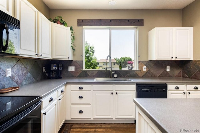 2214 E 101st Ave, Thornton, CO 80229 - kitchen featuring black microwave, dishwashing machine, white cabinets, dark wood-style flooring, and tasteful backsplash