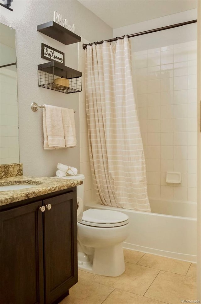 full bathroom with shower / bath combo, toilet, tile patterned flooring, and vanity