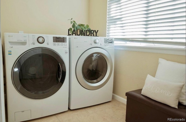 washroom featuring light tile patterned flooring and separate washer and dryer