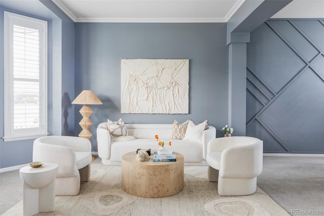 living area with carpet, baseboards, and ornamental molding