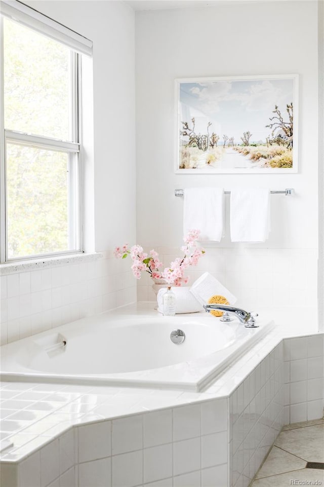 full bathroom with a bath and tile patterned floors