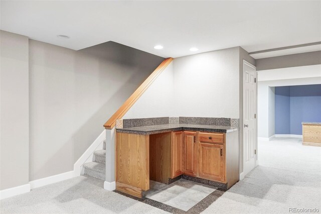 bar featuring light colored carpet, recessed lighting, and baseboards