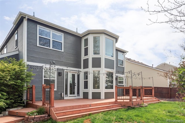 rear view of house with a wooden deck