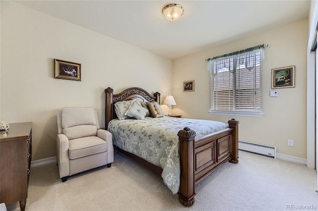 carpeted bedroom featuring baseboard heating