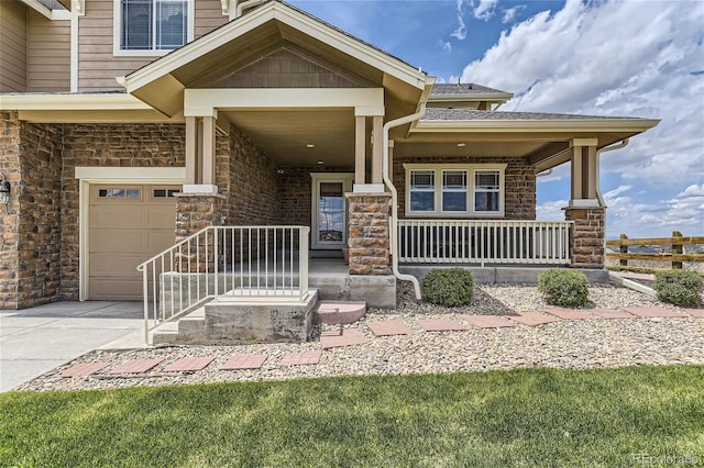 view of front of home with a garage and covered porch