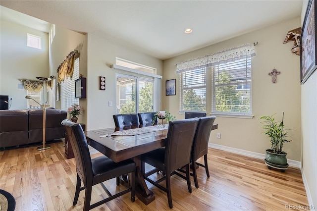 dining space with light hardwood / wood-style floors