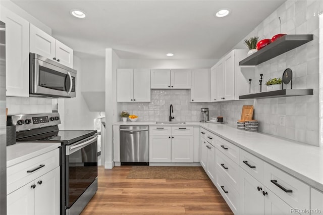 3545 Moorhead Ave, Boulder, CO 80305 - kitchen with stainless steel appliances, open shelves, backsplash, a sink, and recessed lighting