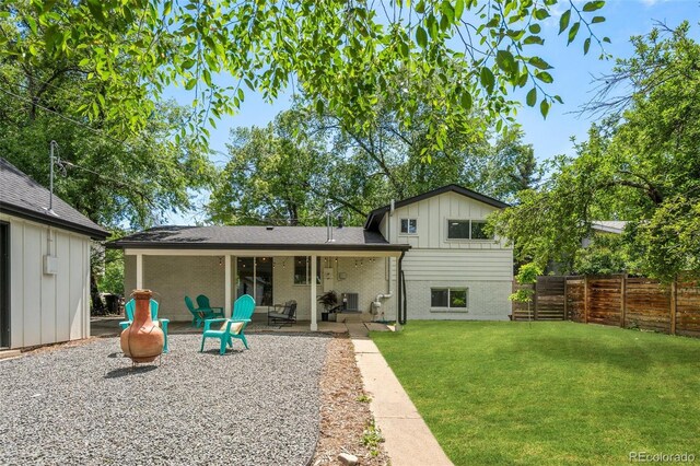 3545 Moorhead Ave, Boulder, CO 80305 - back of property featuring board and batten siding and a patio area