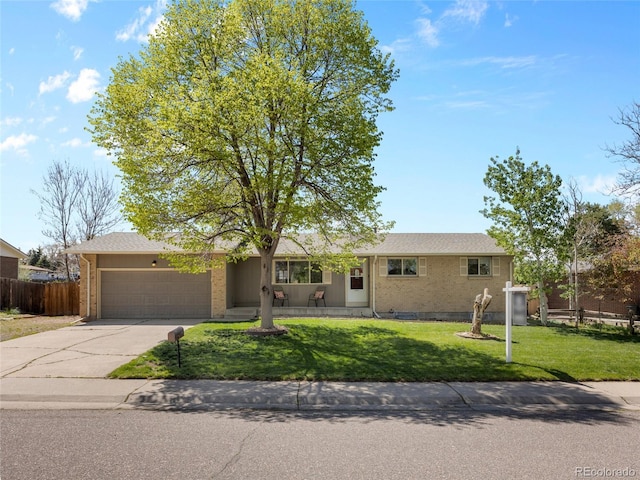 4779 S Owens Way, Littleton, CO 80127 - single story home with a garage, concrete driveway, and brick siding