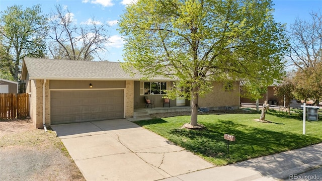 4779 S Owens Way, Littleton, CO 80127 - ranch-style house featuring a garage, driveway, brick siding, and roof with shingles