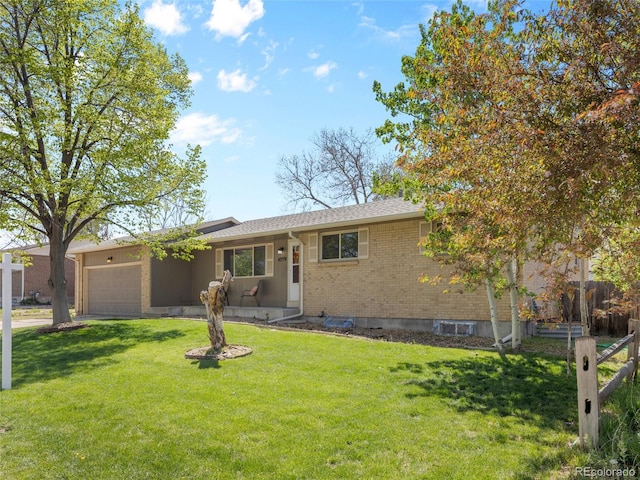 4779 S Owens Way, Littleton, CO 80127 - ranch-style house with a garage, a front lawn, and brick siding