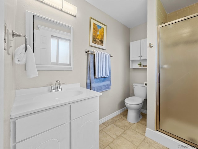 4779 S Owens Way, Littleton, CO 80127 - bathroom featuring toilet, vanity, a stall shower, and baseboards