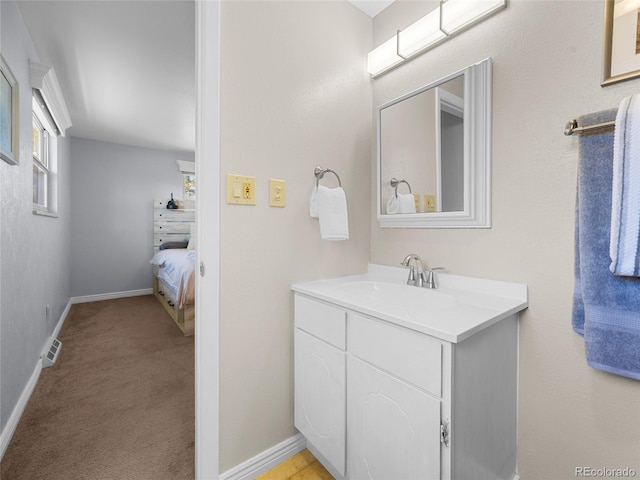 4779 S Owens Way, Littleton, CO 80127 - bathroom featuring vanity and baseboards