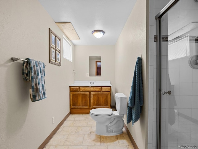 4779 S Owens Way, Littleton, CO 80127 - full bathroom with toilet, baseboards, a stall shower, and vanity
