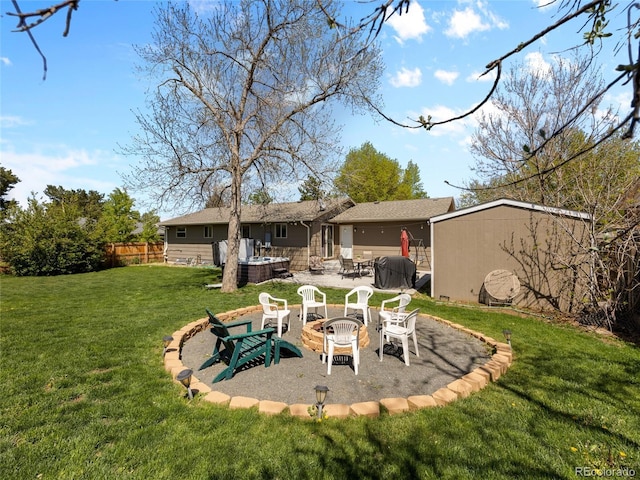 4779 S Owens Way, Littleton, CO 80127 - rear view of house featuring a fire pit, a patio, and a jacuzzi