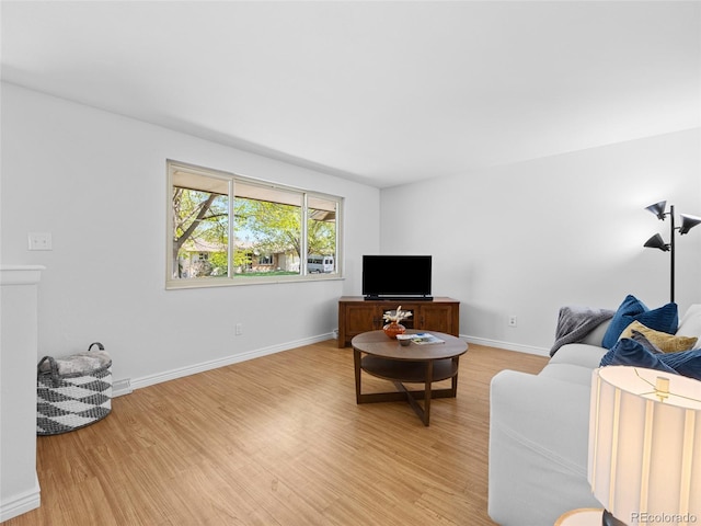 4779 S Owens Way, Littleton, CO 80127 - living area with light wood-type flooring and baseboards