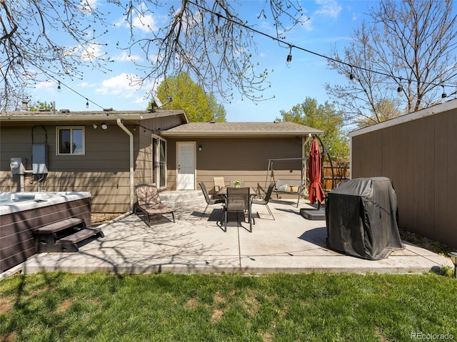 4779 S Owens Way, Littleton, CO 80127 - back of house with a hot tub and a patio