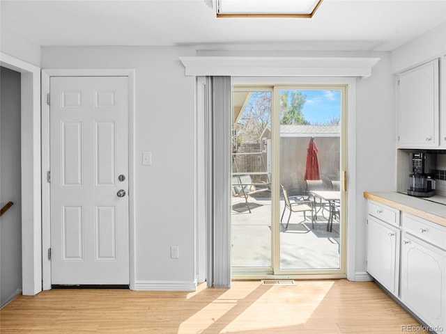 4779 S Owens Way, Littleton, CO 80127 - doorway to outside with light wood-style flooring