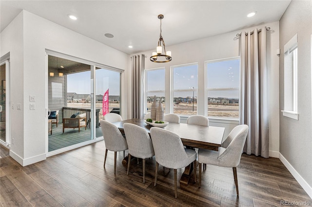 16655 W 93rd Pl, Arvada, CO 80007 - dining space with dark wood-style floors, a chandelier, and recessed lighting