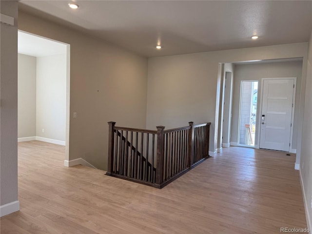 16655 W 93rd Pl, Arvada, CO 80007 - corridor with an upstairs landing, light wood finished floors, baseboards, and recessed lighting