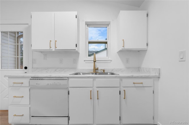 kitchen with white cabinets, dishwasher, and a sink