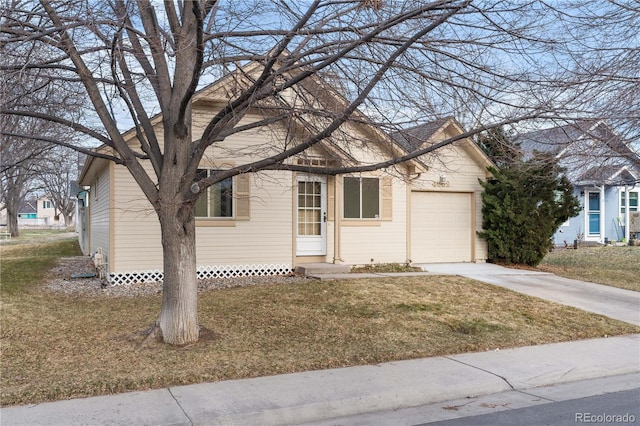 view of front of property with entry steps, a front yard, an attached garage, and concrete driveway