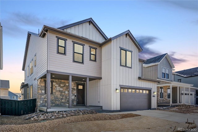 8858 Moonshimmer Trl, Littleton, CO 80125 - modern farmhouse style home with covered porch, board and batten siding, a garage, driveway, and stone siding