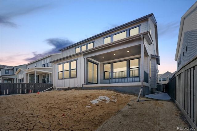 8858 Moonshimmer Trl, Littleton, CO 80125 - rear view of property with a fenced backyard and board and batten siding