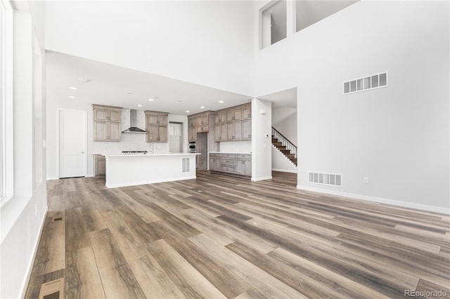 8858 Moonshimmer Trl, Littleton, CO 80125 - unfurnished living room featuring light wood-style flooring and recessed lighting