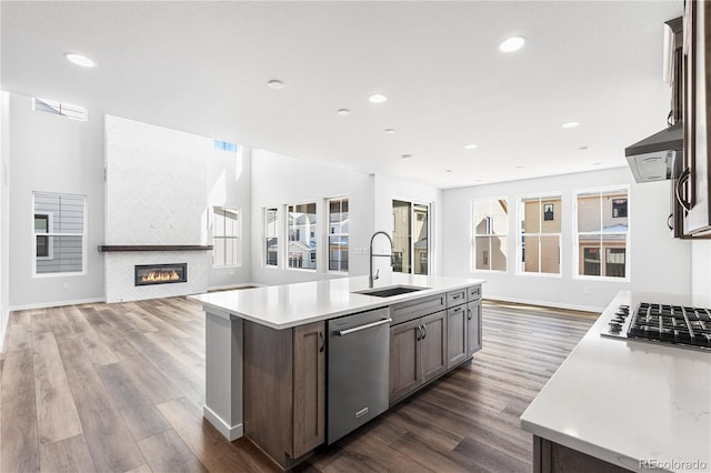 8858 Moonshimmer Trl, Littleton, CO 80125 - kitchen with stainless steel appliances, open floor plan, dark wood-style floors, light countertops, and recessed lighting