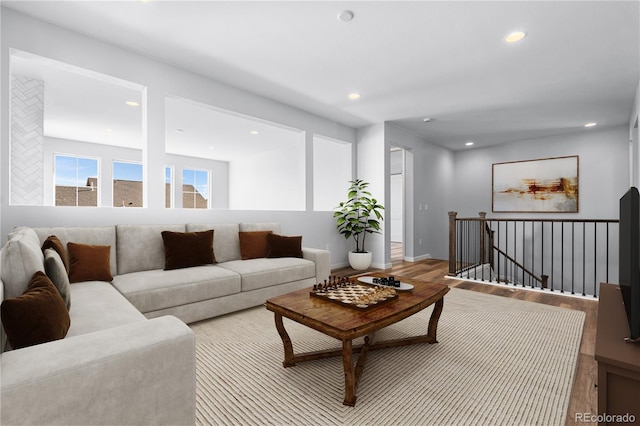 8858 Moonshimmer Trl, Littleton, CO 80125 - living room featuring wood finished floors and recessed lighting