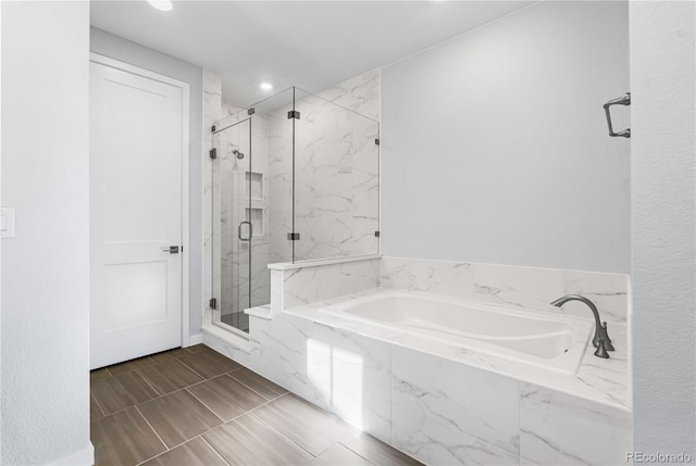 8858 Moonshimmer Trl, Littleton, CO 80125 - full bath featuring a marble finish shower, a bath, and recessed lighting