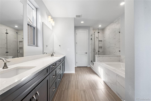 8858 Moonshimmer Trl, Littleton, CO 80125 - full bath with a garden tub, a marble finish shower, double vanity, and recessed lighting