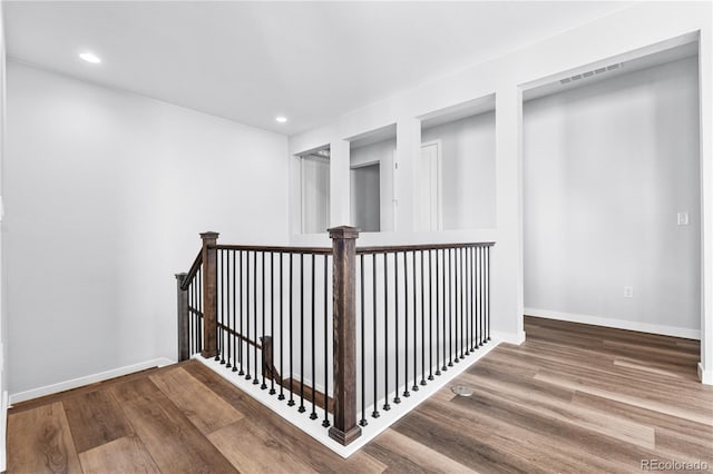 8858 Moonshimmer Trl, Littleton, CO 80125 - corridor featuring wood finished floors and recessed lighting