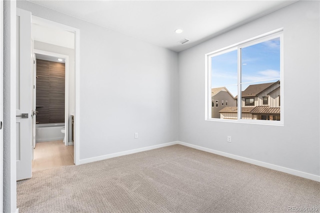8858 Moonshimmer Trl, Littleton, CO 80125 - spare room featuring carpet flooring and baseboards