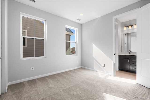 8858 Moonshimmer Trl, Littleton, CO 80125 - unfurnished bedroom with light colored carpet and ensuite bath