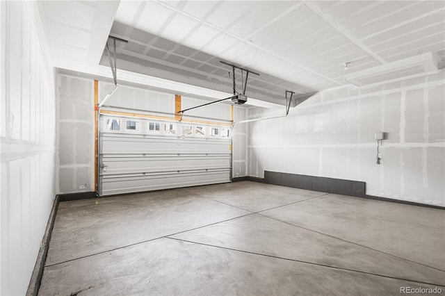 8858 Moonshimmer Trl, Littleton, CO 80125 - garage with a garage door opener and baseboards